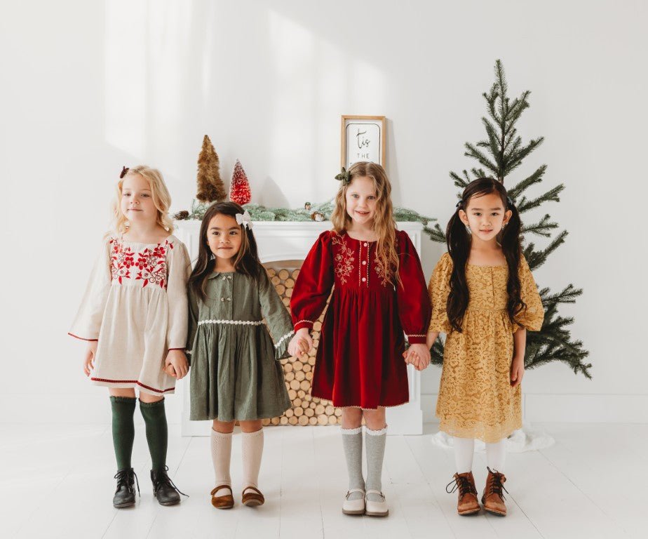 Handmade girls' dresses, featuring festive floral prints, lace collars, and sustainable fabrics for Christmas celebrations.