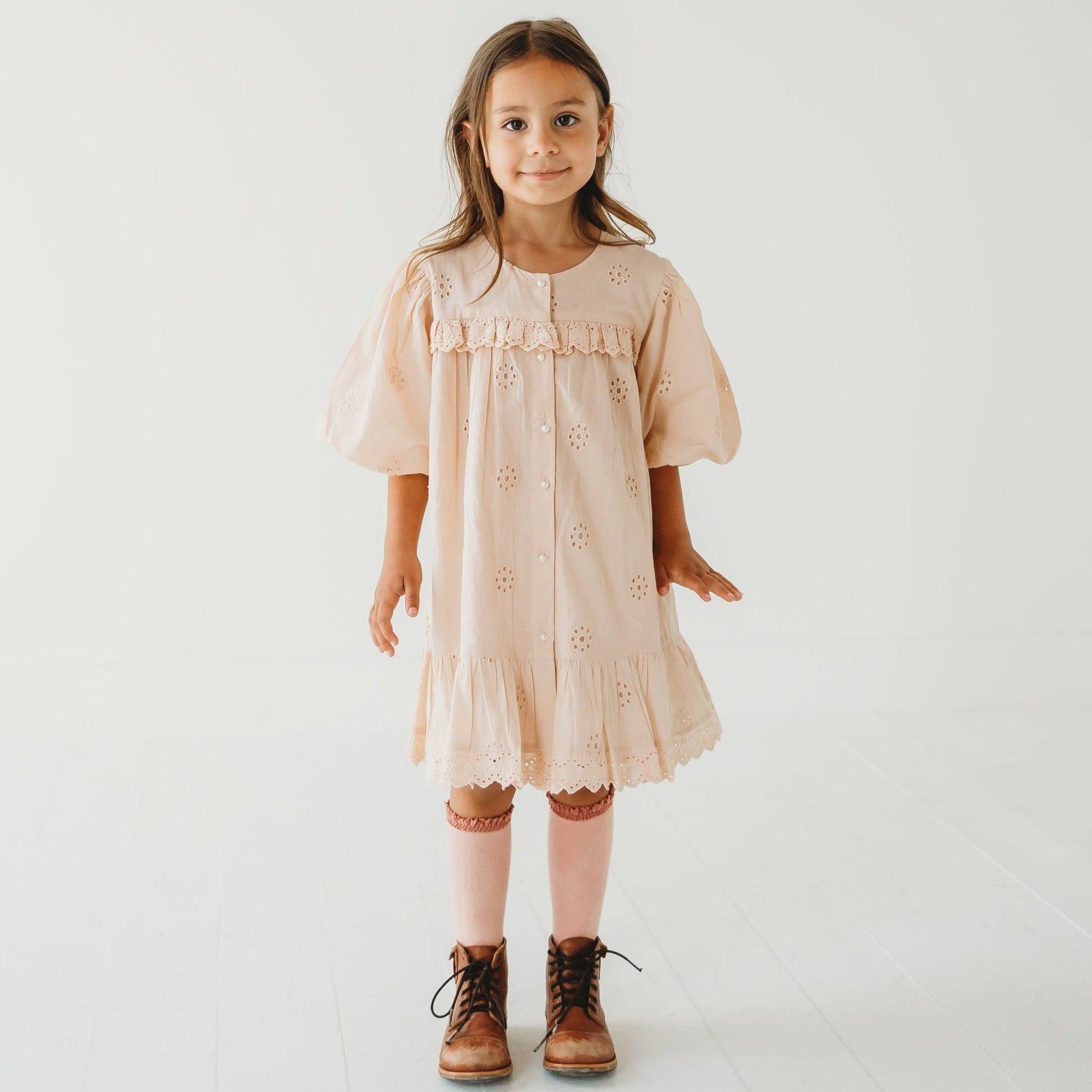 A 5-year-old model showing the Embroidered Schiffli Dress - LARILI