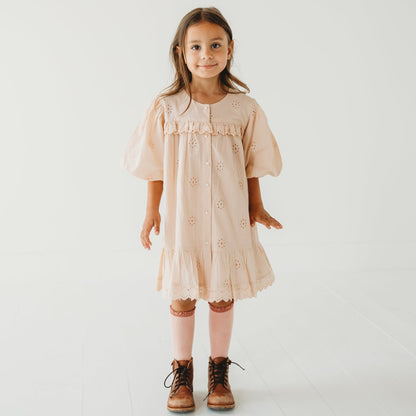 A 5-year-old model showing the Embroidered Schiffli Dress - LARILI