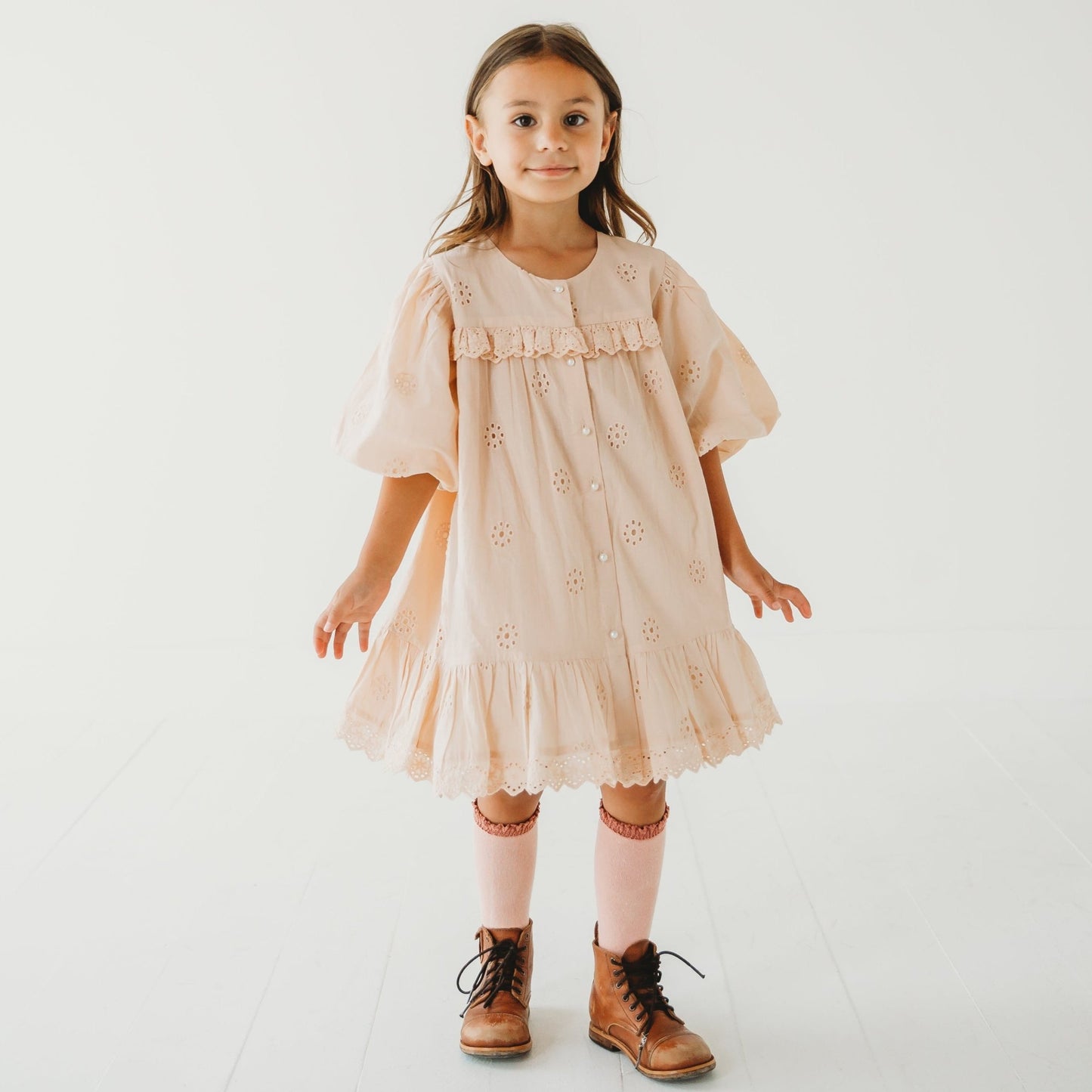 A 5-year-old model showing the Embroidered Schiffli Dress - LARILI