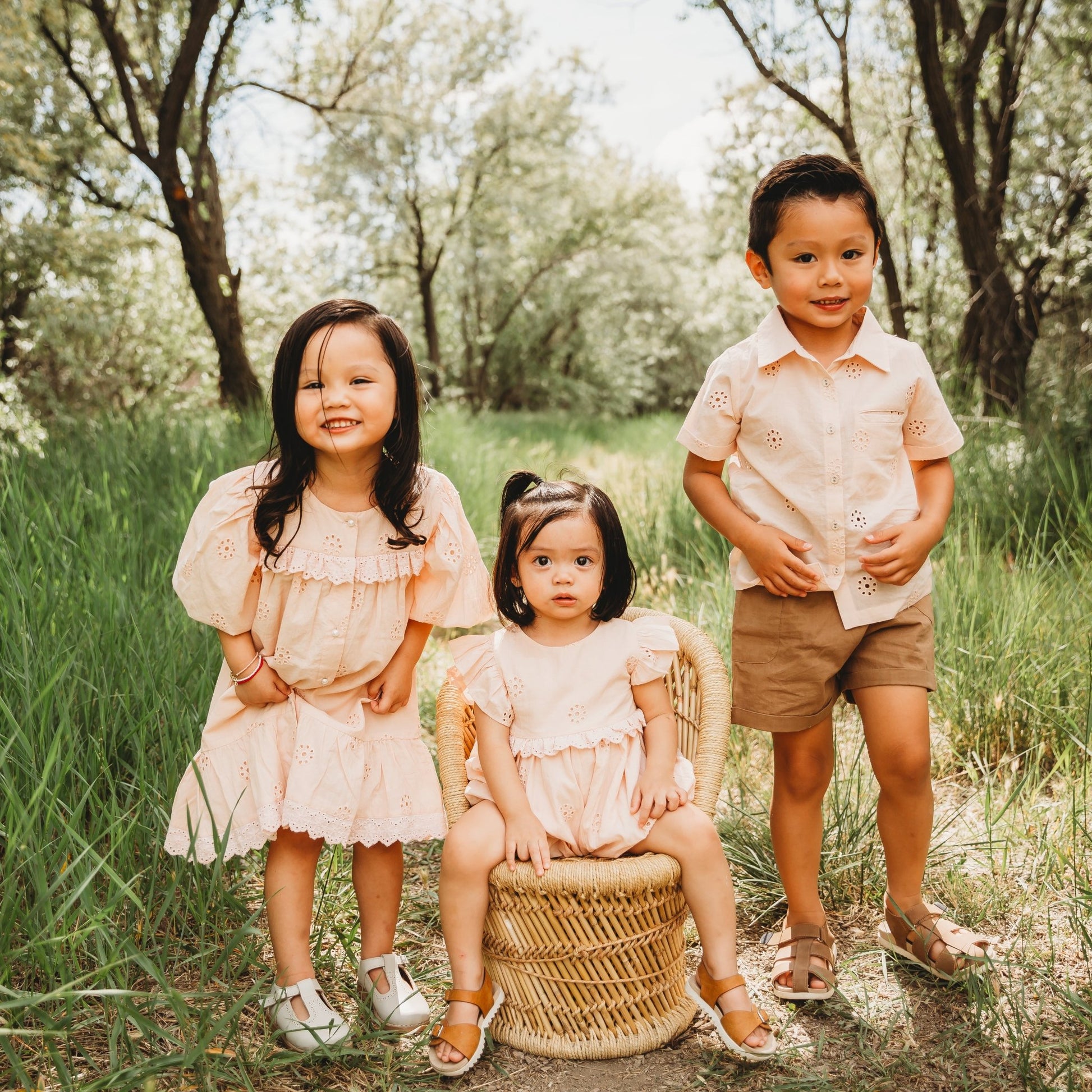 A 2-year-old model showing the sibling match Embroidered Schiffli Romper - LARILI