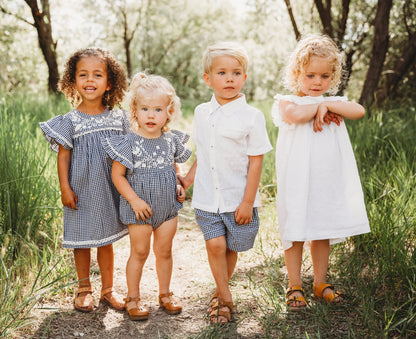A 5-year-old model showing the group photo sibling matched Embroidered Yoke Eith Ruffle Sleeves Dress - LARILI