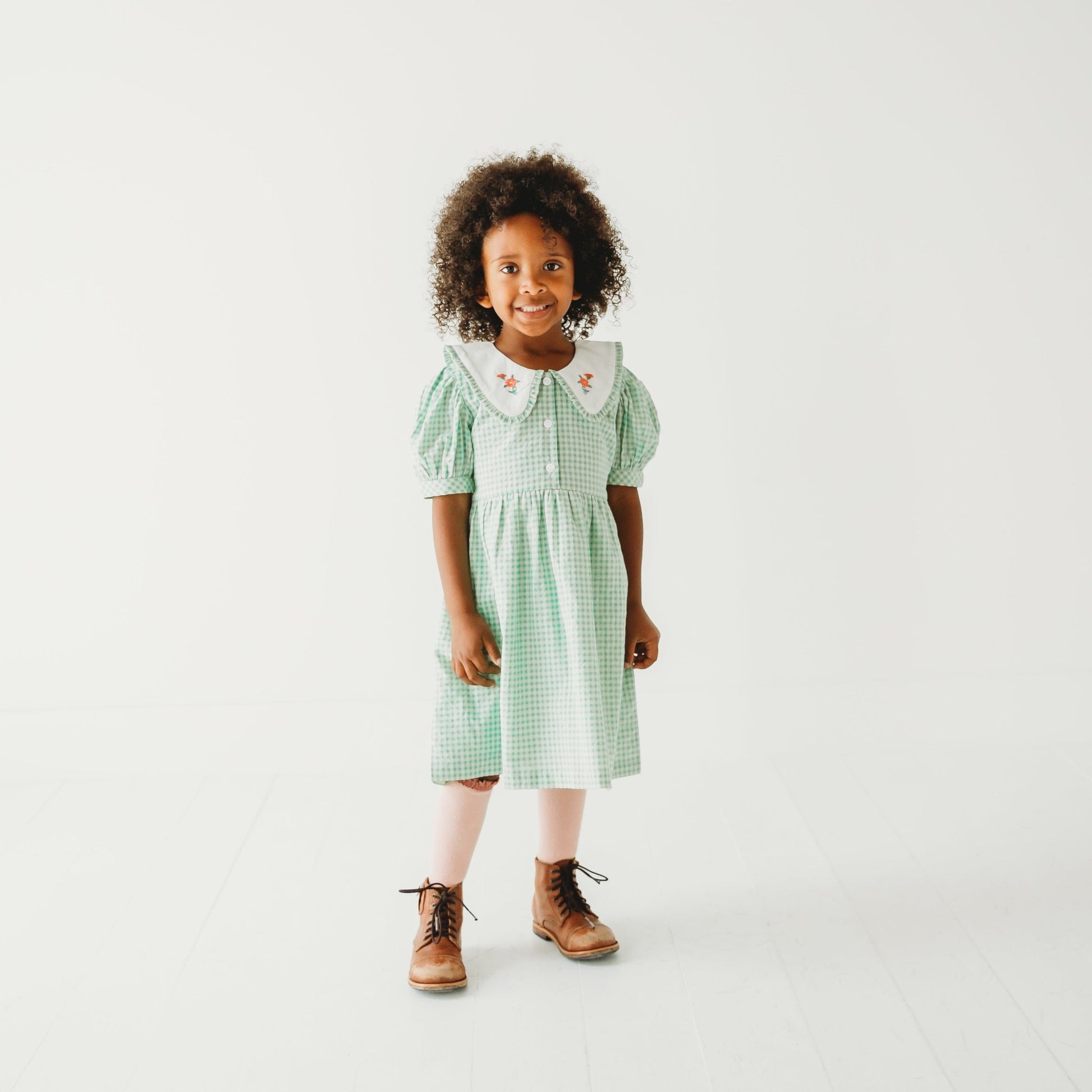 5 Year old Girl wearing Green Gingham Emb. Mia Dress - LARILI