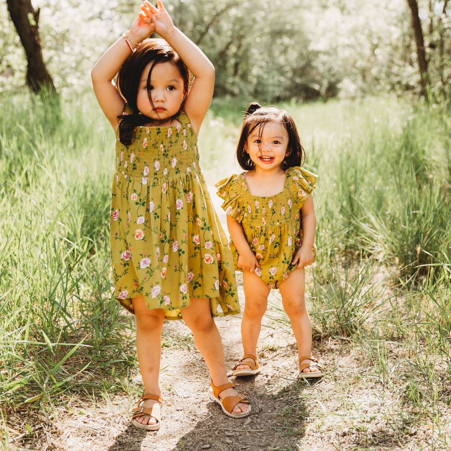 A 3-year-old model showing the sibling matched Smocking High & Low Dress - LARILI