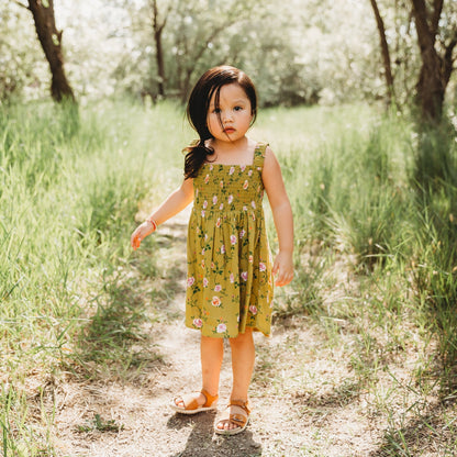 A 3-year-old model showing the Smocking High & Low Dress - LARILI