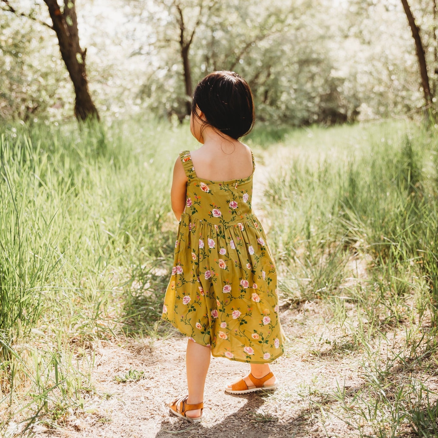 A 3-year-old model showing the back view of Smocking High & Low Dress - LARILI