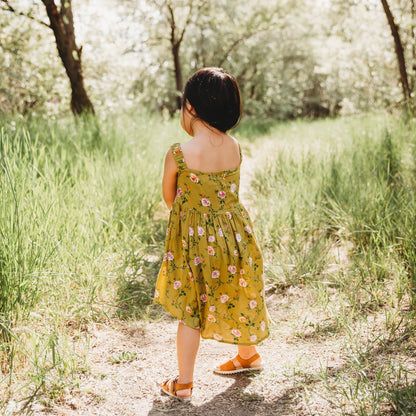 A 3-year-old model showing the back view of Smocking High & Low Dress - LARILI
