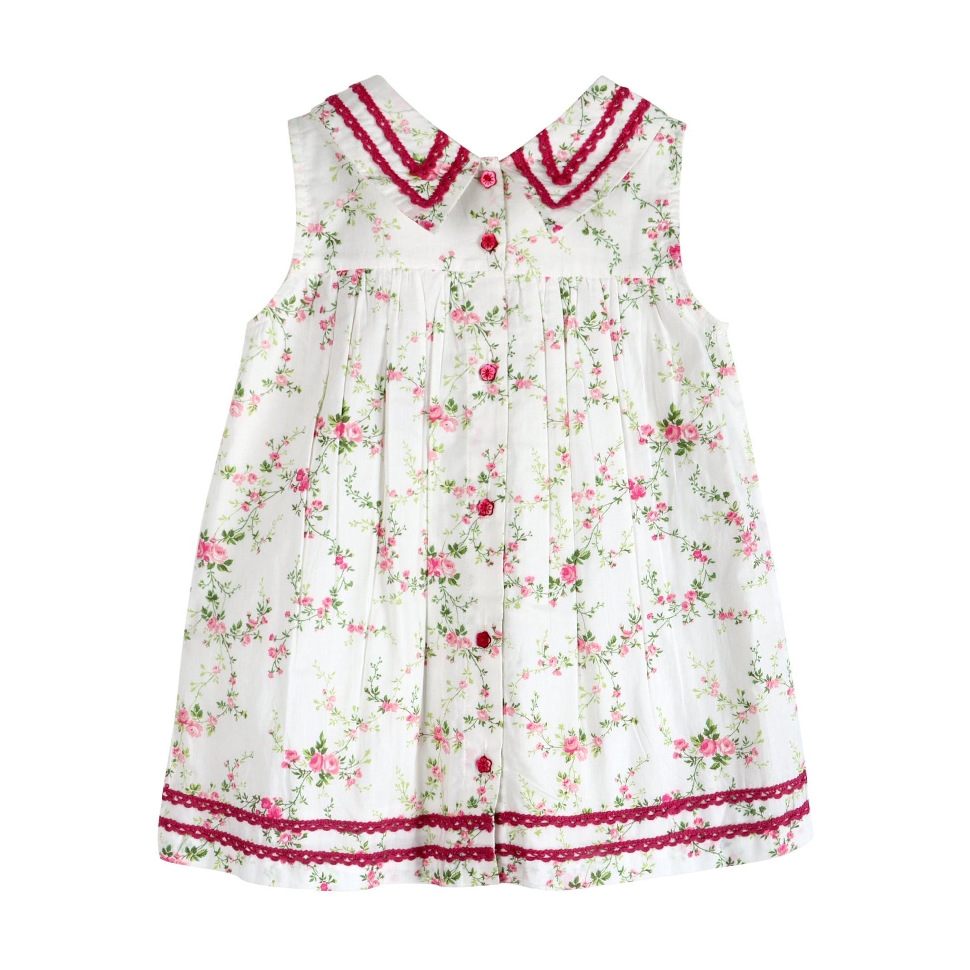 Back view of LARILI Victorian Rosebud dress. Pink floral cotton with lace V-neck and vintage button back.