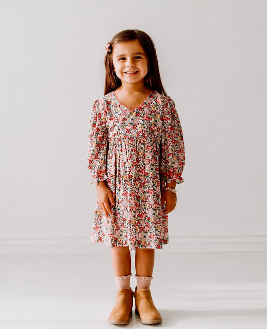 A 3-year-old model showing the Long Sleeves Pink Bloom Overlap Girl's Cotton Dress - LARILI